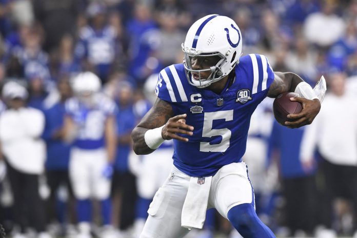 Indianapolis Colts Quarterback Anthony Richardson (5) advances the ball during the NFL game between the Jacksonville Jaguars and the Indianapolis Colts on September 10, 2023, at Lucas Oil Stadium in Indianapolis, Indiana.