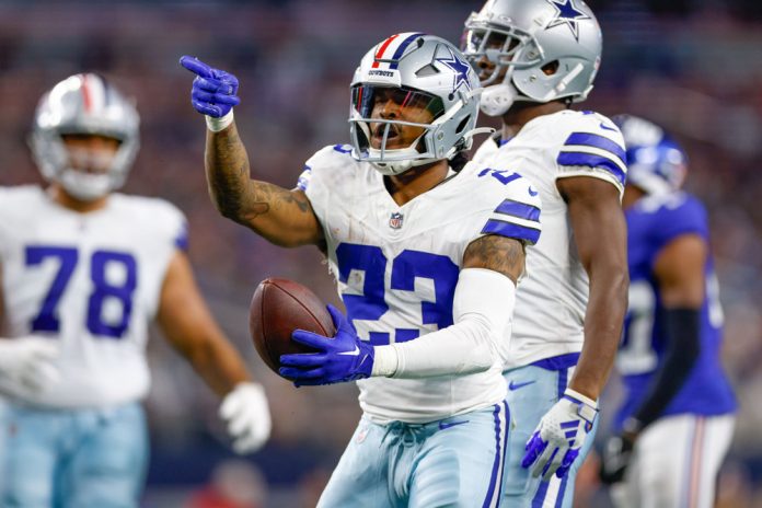 Dallas Cowboys running back Rico Dowdle (23) celebrates after making a first down during the game between the Dallas Cowboys and New York Giants on November 12, 2023 at AT&T Stadium in Arlington, TX.