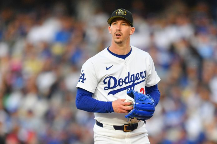 Los Angeles Dodgers pitcher Walker Buehler (21) looks on during the MLB game between the Cincinnati Reds and the Los Angeles Dodgers on May 18, 2024 at Dodger Stadium in Los Angeles, CA.