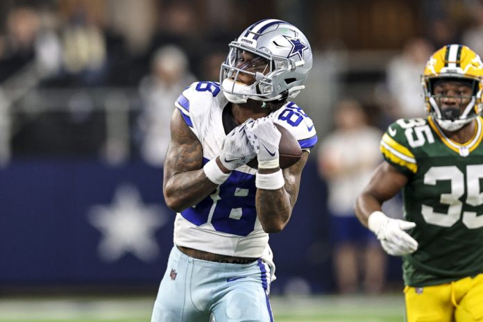 Dallas Cowboys wide receiver CeeDee Lamb (88) catches a pass for a first down during the NFC Wild Card game between the Dallas Cowboys and the Green Bay Packers on January 14, 2024 at AT&T Stadium in Arlington, Texas.