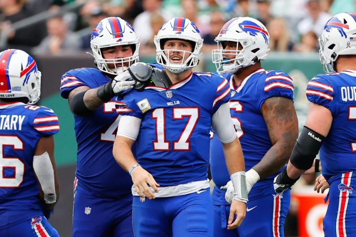 Buffalo Bills quarterback Josh Allen (17) gets his shoulder pad fixed during the National Football League game between the New York Jets and Buffalo Bills on November 6, 2022 at MetLife Stadium in East Rutherford, New Jersey.