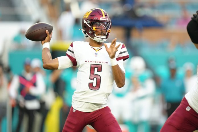 Washington Commanders quarterback Jayden Daniels (5) makes a pass attempt in the first half during the game between the Washington Commanders and the Miami Dolphins on Saturday, August 17, 2024 at Hard Rock Stadium in Miami Gardens, Fla.