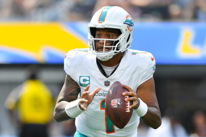 Miami Dolphins quarterback Tua Tagovailoa (1) rolls out during the NFL regular season game between the Miami Dolphins and the Los Angeles Chargers on September 10, 2023, at SoFi Stadium in Inglewood, CA.