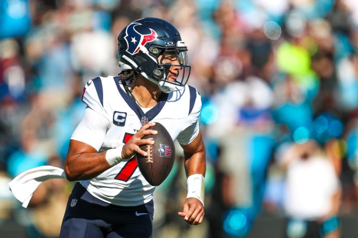 C.J. Stroud #7 of the Houston Texans runs with the ball during a football game against the Carolina Panthers at Bank of America Stadium in Charlotte, North Carolina on Oct 29, 2023.