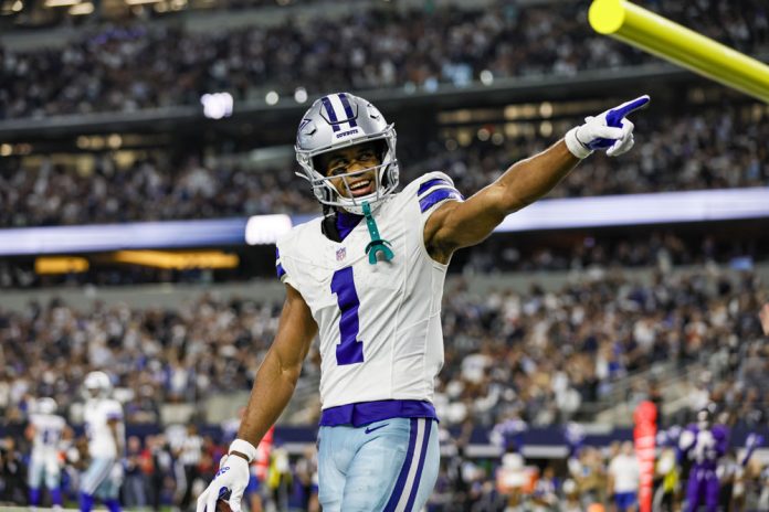 Dallas Cowboys wide receiver Jalen Tolbert (1) scores a touchdown and points to the crowd during the game between the Dallas Cowboys and the Baltimore Ravens on September 22, 2024 at AT&T Stadium in Arlington, Texas.