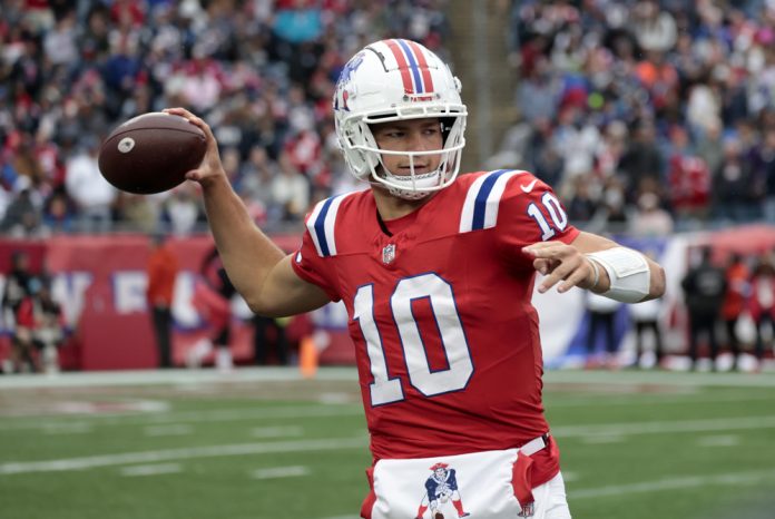 New England Patriots quarterback Drake Maye (10) throws during a game between the New England Patriots and the Houston Texans on October 13, 2024, at Gillette Stadium in Foxborough, Massachusetts.