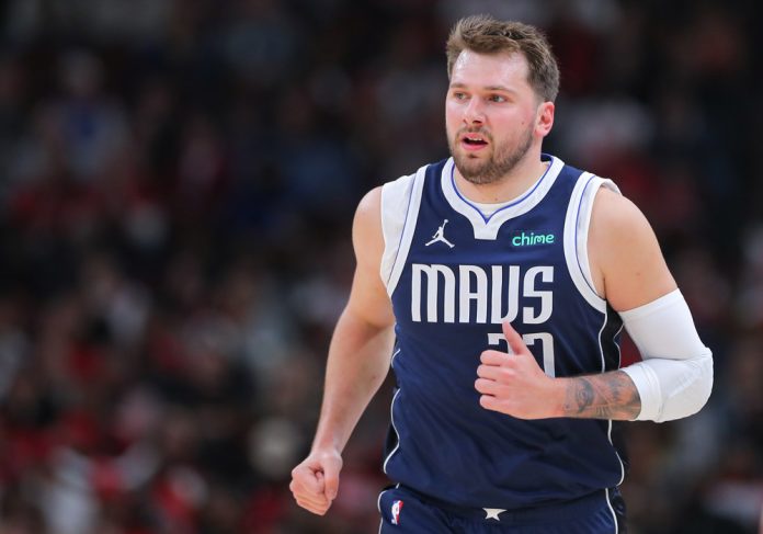 Luka Doncic #77 of the Dallas Mavericks looks on during the first half against the Chicago Bulls at United Center on March 11, 2024 in Chicago, Illinois.