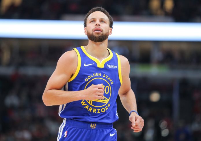 Stephen Curry #30 of the Golden State Warriors looks on during the first half against the Chicago Bulls at the United Center on January 12, 2024 in Chicago, Illinois.